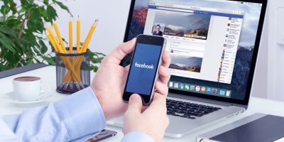 facebook workplace employee mobile laptop
