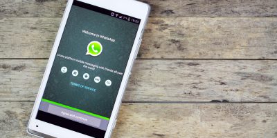 smartphone on the table and whatsapp on screen