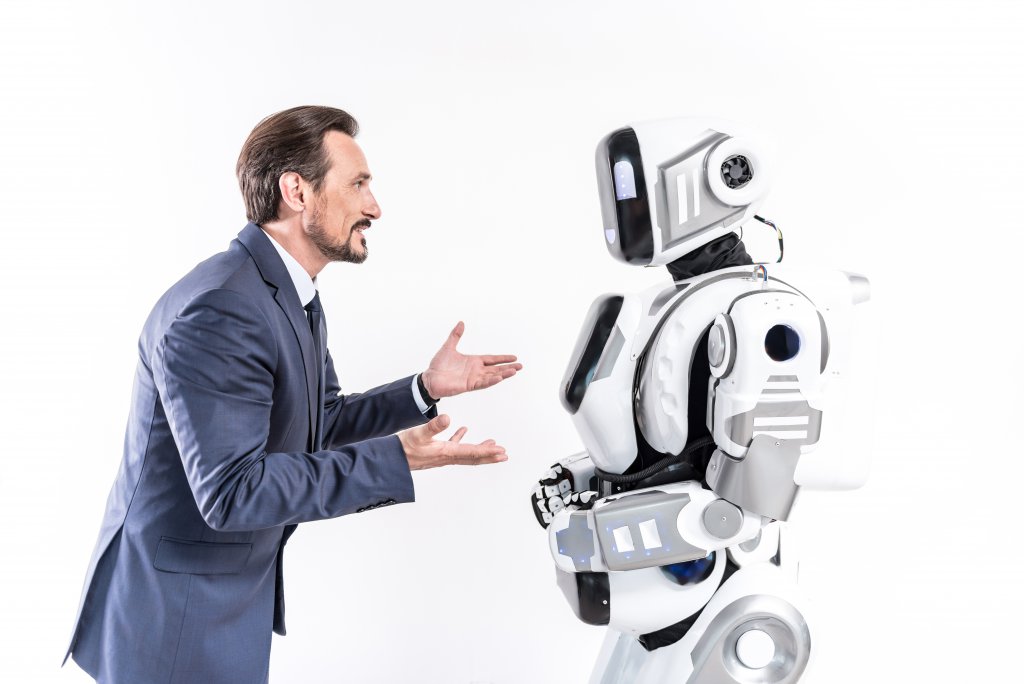 man teaches robot