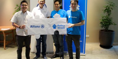 Allianz executive with PolicyStreet founders at the partnership announcements