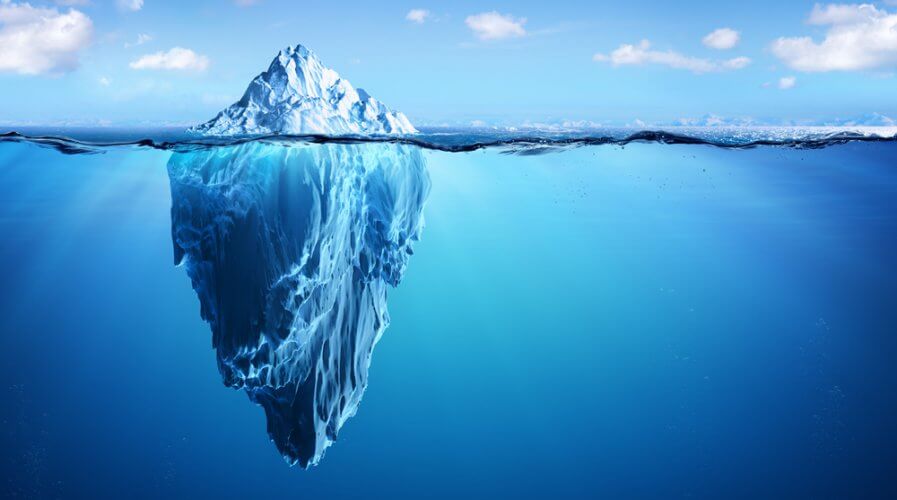 a picture with an iceberg with most of it underwater