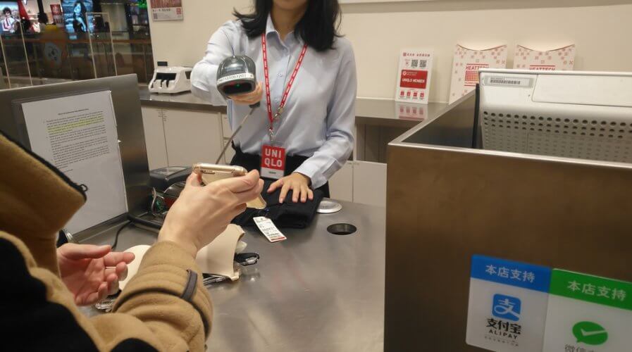 a person making payment with WeChat Pay