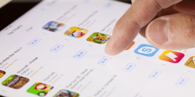 a person browsing for apps in the app store on a tablet