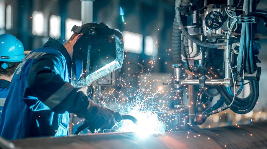 a worker welding in a factory