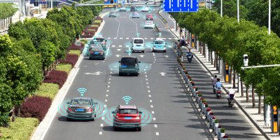 self driving cars on the road communicates with each other to make traffic smoother