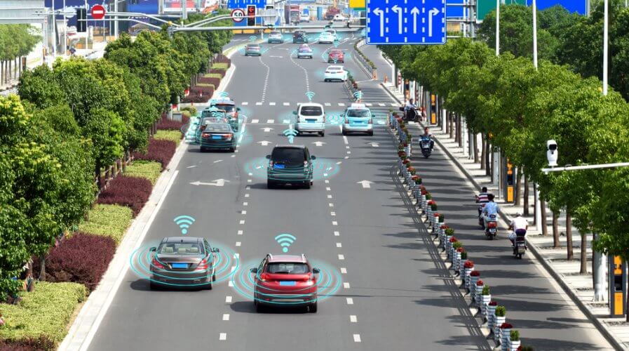 self driving cars on the road communicates with each other to make traffic smoother