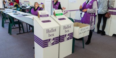 officials at a polling place in australia