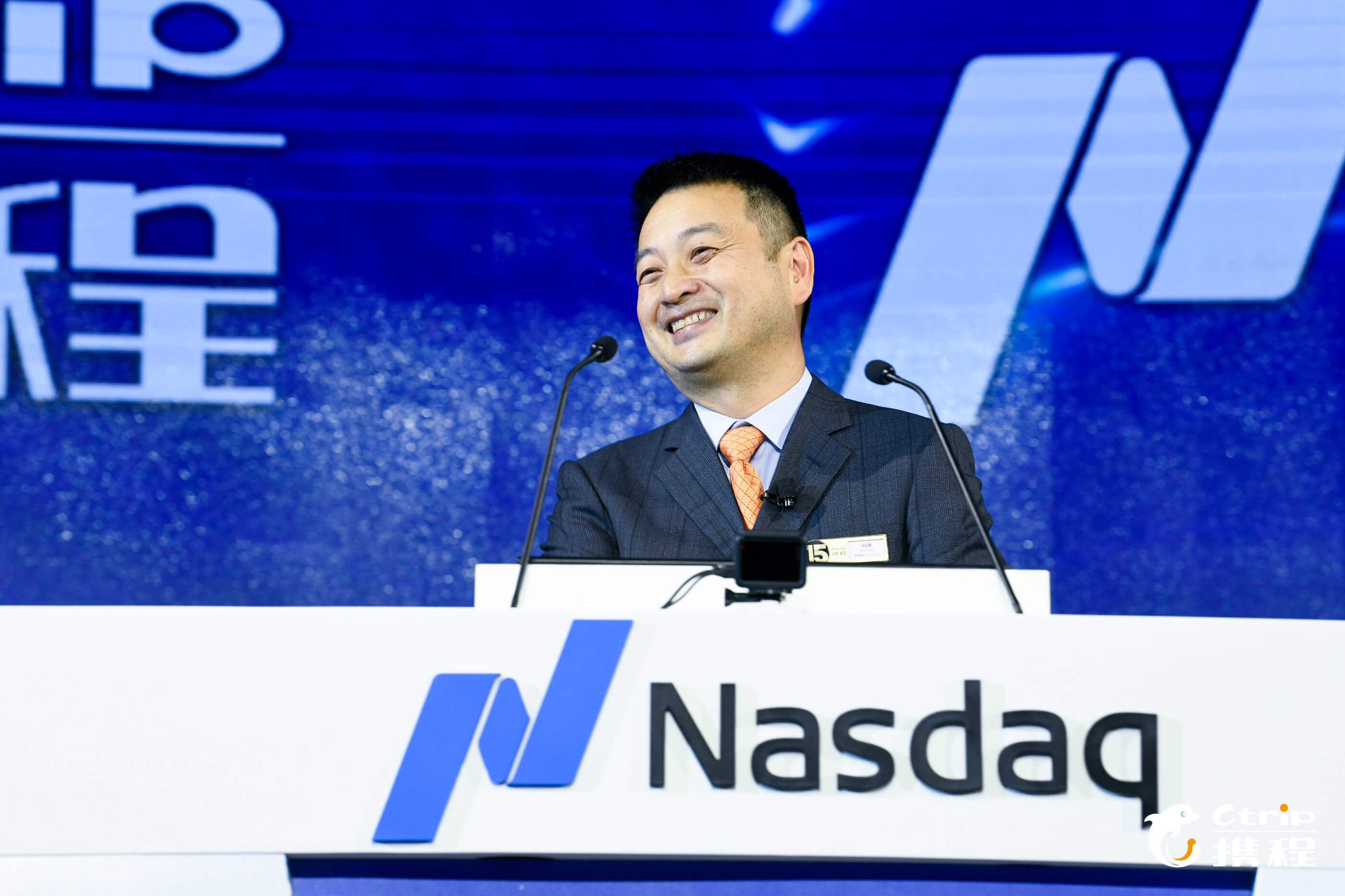 Trip.com chairman James Liang at a conference. Source: Ctrip.com