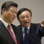 Chinese President Xi Jinping (L) is shown around the offices of Huawei by its President Ren Zhengfei. Source: AFP