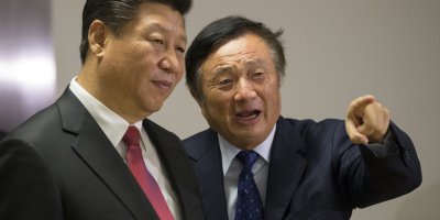 Chinese President Xi Jinping (L) is shown around the offices of Huawei by its President Ren Zhengfei. Source: AFP