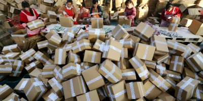 Workers sorting out packages for Single's Day Sale, one of the largest e-commerce events. Source: AFP.