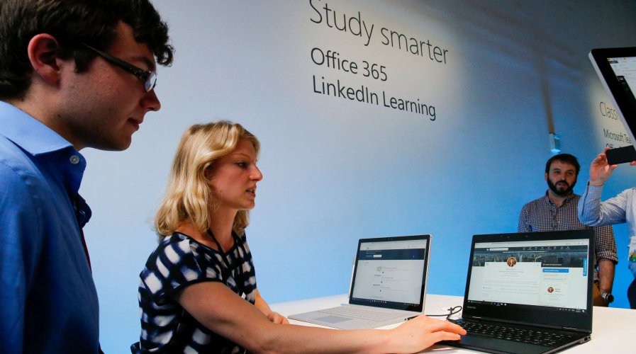 Members of the LinkedIn Learning team showing how the online learning platform can help students prepare for their job search. Source: AFP