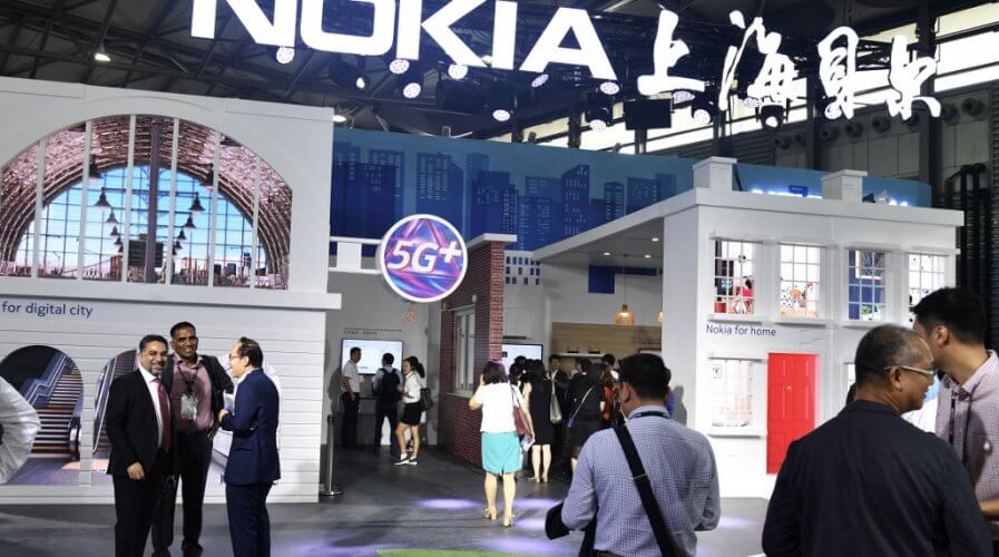 People gathering at a Nokia booth during the Mobile World Conference in Shanghai.
