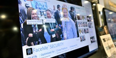 A video monitor displays attendees captured with CyperLink's facial recognition tech at CES 2020