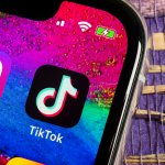 TikTok application icon on Apple iPhone X screen