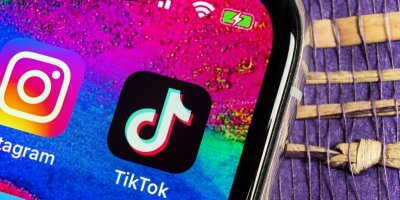 TikTok application icon on Apple iPhone X screen