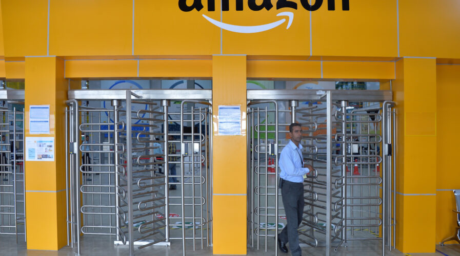 Employee of Amazon India walks out of a security gate at Amazon's fulfilment center on the outskirts of Bangalore.