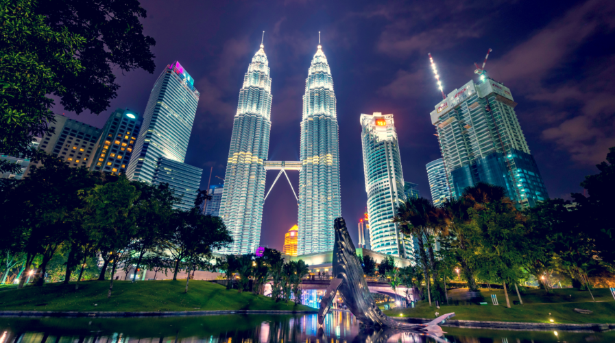 Kuala Lumpur, Federal Territory / Malaysia - September 4 2020: Petronas Twin Towers in blue hours with its park in the foreground.