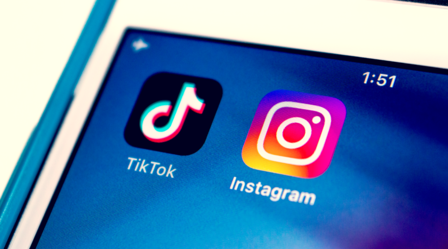 TikTok and Instagram apps on iPhone on white background. In August 2020, Instagram has launches new video feature called Instagram Reels to rival TikTok