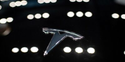 A Tesla logo is seen on the Model 3, a popular car model affected by the Tesla recalls (Photo by NICOLAS ASFOURI / AFP)