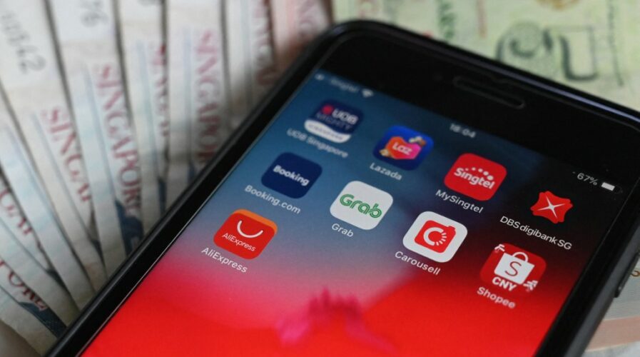 The APAC region has seen a massive jump in downloads of fintech apps, showing strong support for fintech to grow in the region. (Photo by Roslan RAHMAN / AFP)