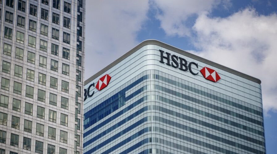 HSBC has closed branches across the UK and Asia - how can the industry deal with the rise of digital banking? (Photo by Tolga Akmen / various sources / AFP)