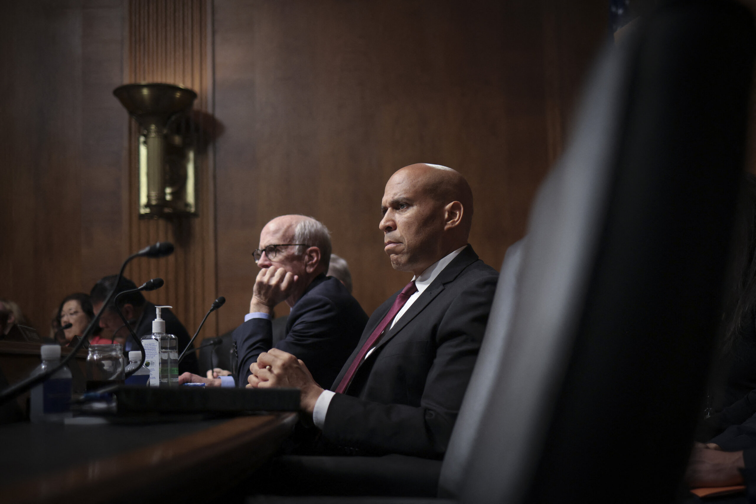 WASHINGTON, DC - MAY 16: Sen. Cory Booker (R) (D-NJ) asks questions as Samuel Altman, CEO of OpenAI, testifies before the Senate Judiciary Subcommittee on Privacy, Technology, and the Law May 16, 2023 in Washington, DC. The committee held an oversight hearing to examine A.I., focusing on rules for artificial intelligence. Win McNamee/Getty Images/AFP (Photo by WIN MCNAMEE / GETTY IMAGES NORTH AMERICA / Getty Images via AFP)
