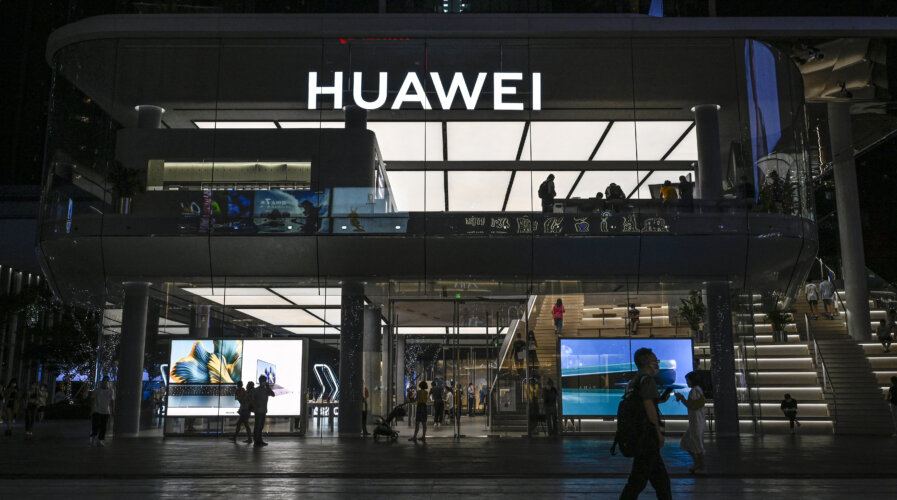 Huawei’s consumer business group, including Huawei smartphones and smart car solutions, recorded growth and increased revenue for the first time in three years. Source: (Photo by Jade GAO / AFP)