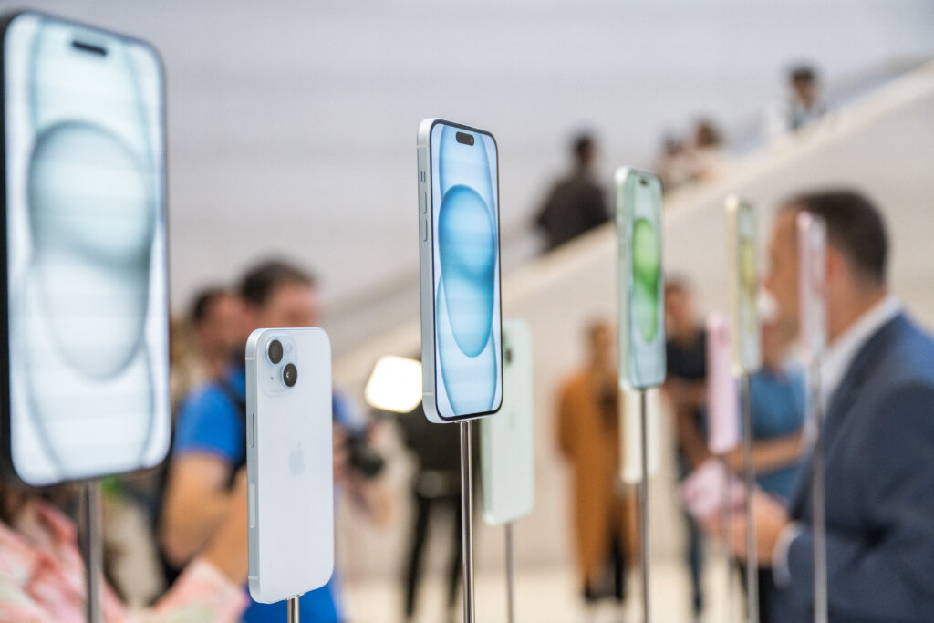 The new Apple iPhone 15, with EU ordered USB-C charger, is displayed among other new products during a launch event at Apple Park.