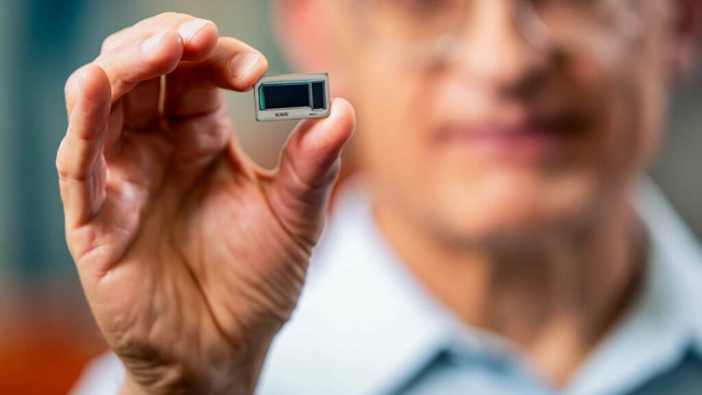 Hamid Azimi, corporate vice president and director of substrate technology development at Intel Corporation, holds an Intel assembled glass substrate test chip at Intel's Assembly and Test Technology Development factories in Chandler, Arizona, in July 2023. Intel’s advanced packaging technologies come to life at the company's Assembly and Test Technology Development factories. (Credit: Intel Corporation)