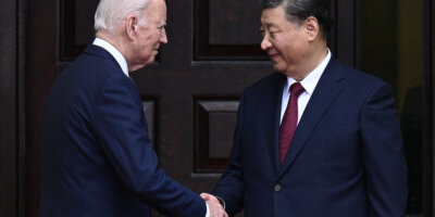 US President Joe Biden greets Chinese President Xi Jinping before a meeting during the Asia-Pacific Economic Cooperation (APEC) Leaders' week in Woodside, California on November 15, 2023. They aimed to lessen US-China tensions. (Photo by Brendan SMIALOWSKI / AFP).