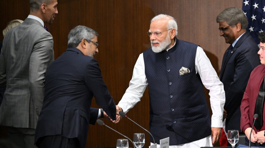 India's Prime Minister Narendra Modi shakes hands with Micron Technology CEO Sanjay Mehrotra during a visit to the National Science Foundation in Alexandria, Virginia, on June 21, 2023. (Photo by Mandel NGAN / AFP).