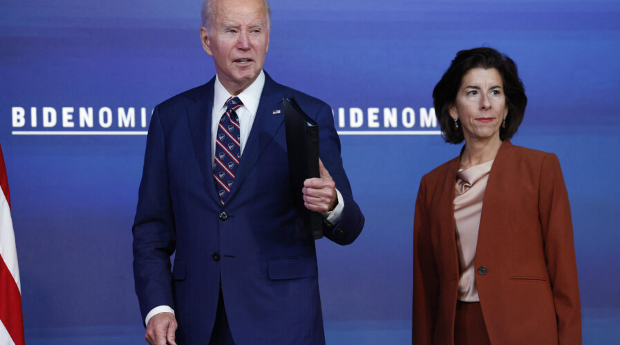 WASHINGTON, DC - OCTOBER 23: U.S. President Joe Biden responds to a question about hostage negotiations with Hamas alongside U.S. Commerce Secretary Gina Raimondo at an event in the South Court Auditorium in the Eisenhower Executive Office Building at the White House on October 23, 2023 in Washington, DC. During the event Biden spoke on how his administration's "Bidenomics" agenda would invest in technology for people in the United States. Anna Moneymaker/Getty Images/AFP (Photo by Anna Moneymaker / GETTY IMAGES NORTH AMERICA / Getty Images via AFP)