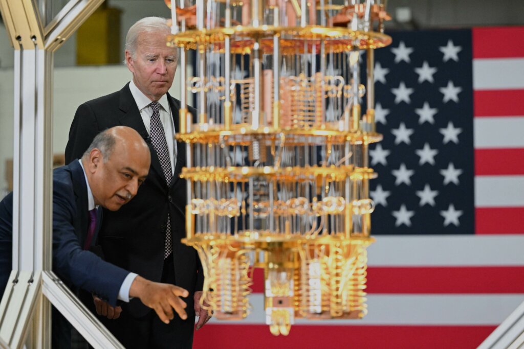 US President Joe Biden looks at a quantum computer with IBM CEO Arvind Krishna as he tours the IBM facility in Poughkeepsie, New York on October 6, 2022.